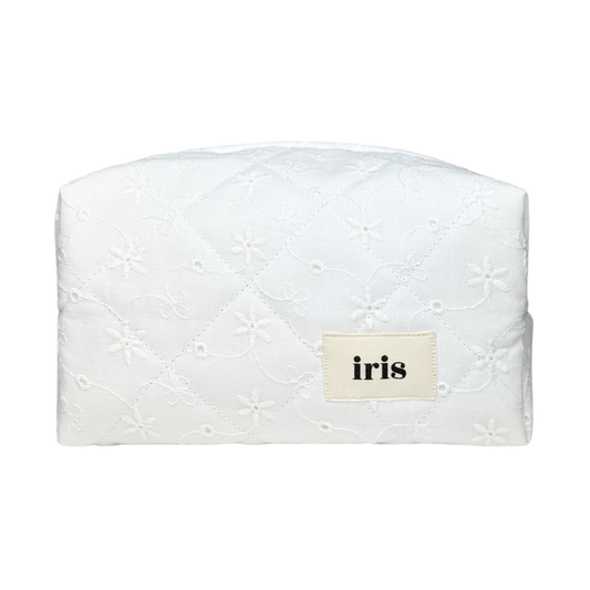 Iris av Emma makeup bag in a creamy white broderie anglaise fabric. All bags are handmade upon order in Sweden!